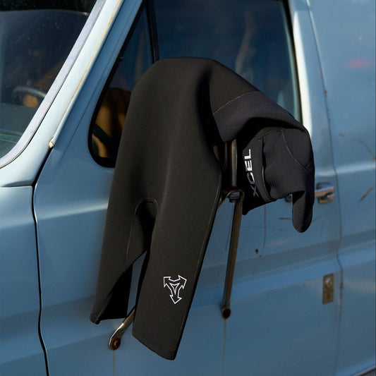 wetsuit drying on van mirror