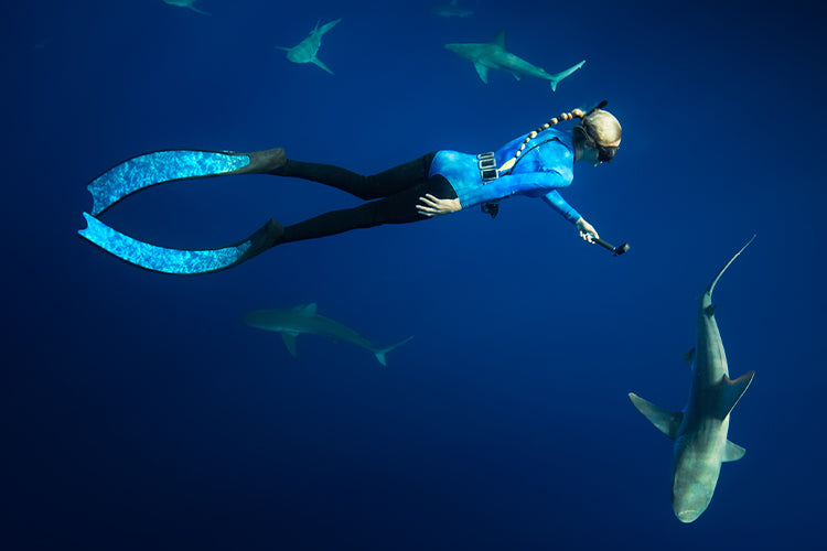 Ocean Ramsey wearing her Xcel Water Inspired springsuit as she dives with sharks
