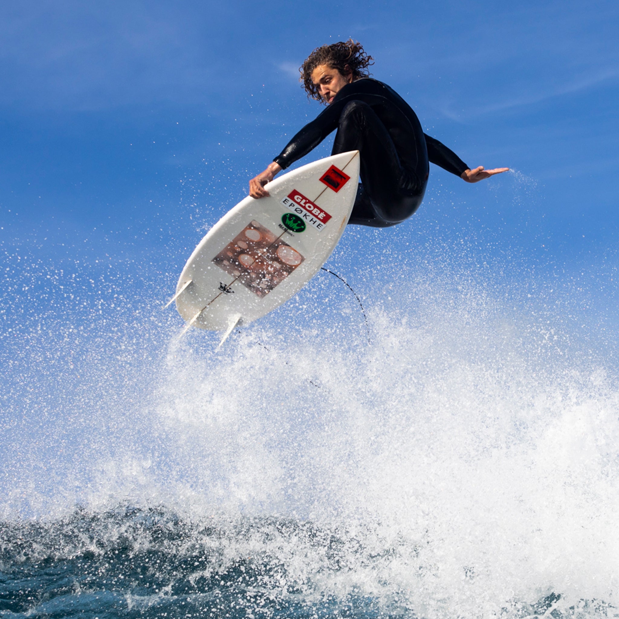 surfer doing an air