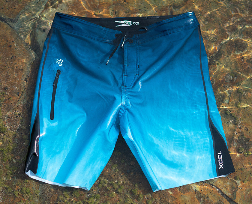 boardshorts floating in shallow water