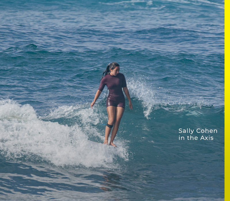 sally surfing in a spring wetsuit 