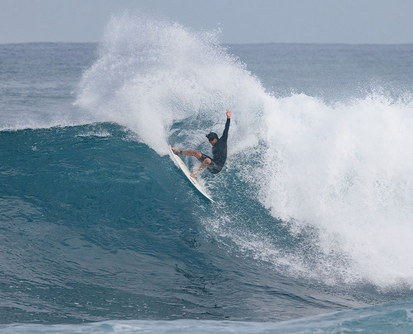 man surfing  in ocena neoprene-free foam springsuit 