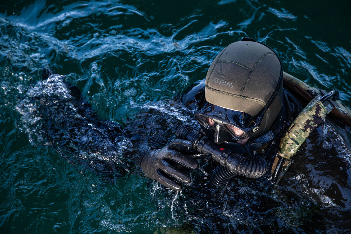 diver in water with wetsuit and breathing apparatus 