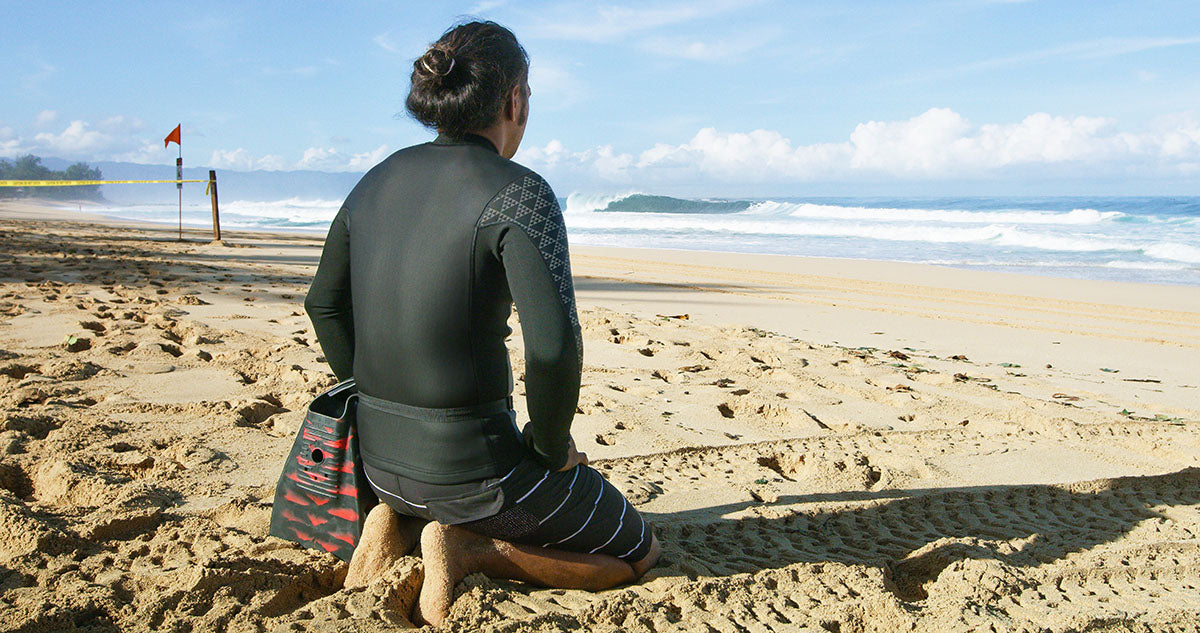 surfer looking at waves