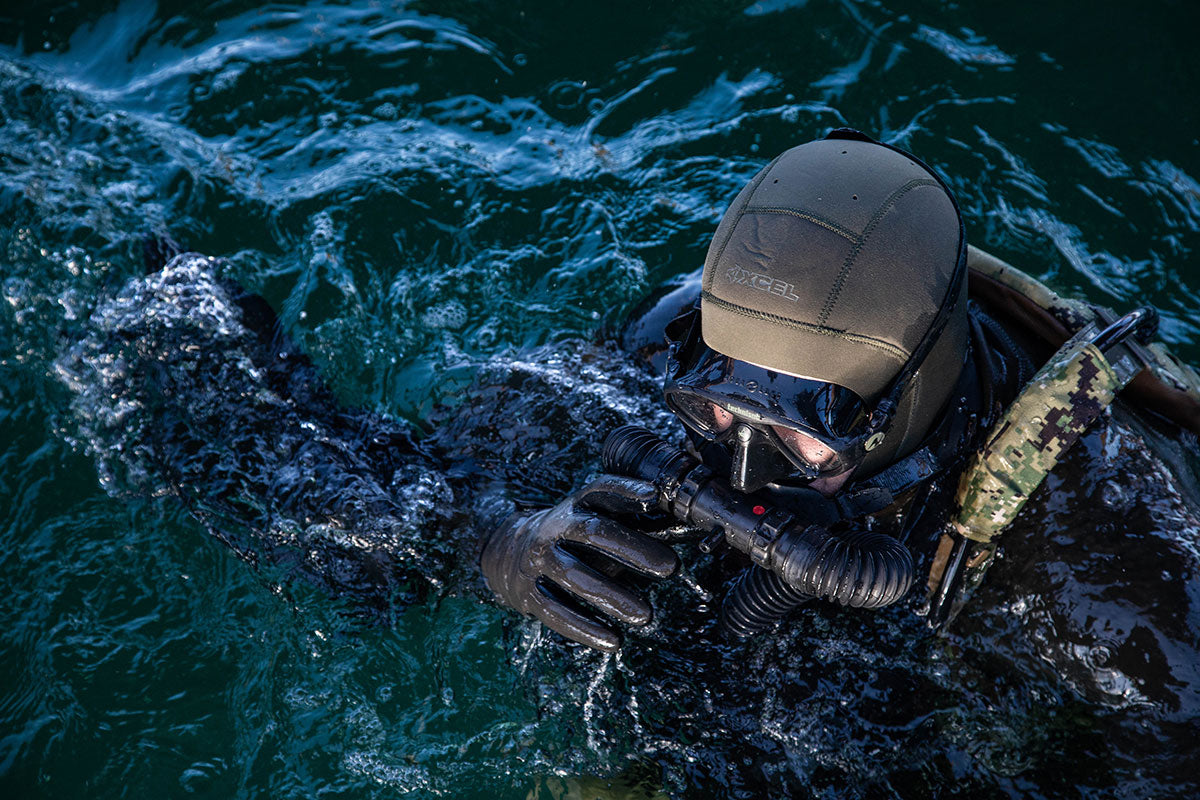 diver with wetsuit and breathing apparatus in the water